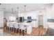 Modern kitchen with white cabinets and blue tile backsplash at 7865 Sw 89Th Cir, Ocala, FL 34481