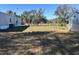 Large backyard behind the manufactured home with shed at 2725 Schreffler Rd, Groveland, FL 34736