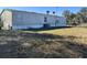 Side view of a mobile home showing the AC unit and satellite dish at 2725 Schreffler Rd, Groveland, FL 34736