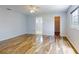 Bedroom with wood-look floors, ceiling fan, and closets at 13729 Se 89Th Ave, Summerfield, FL 34491