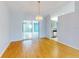 Spacious dining room featuring hardwood floors and a chandelier at 13729 Se 89Th Ave, Summerfield, FL 34491