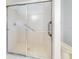 Shower stall with glass enclosure and grab bar at 13729 Se 89Th Ave, Summerfield, FL 34491