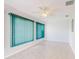 Sunroom with tile floors, ceiling fan, and vertical blinds at 13729 Se 89Th Ave, Summerfield, FL 34491