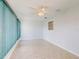 Sunroom with tile floor, ceiling fan, and window at 13729 Se 89Th Ave, Summerfield, FL 34491