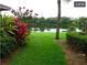 Peaceful backyard with a scenic lake view and lush landscaping at 4537 Ring Neck Rd # C, Orlando, FL 32808