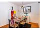 Bright dining area with a glass-top table and colorful decor at 4537 Ring Neck Rd # C, Orlando, FL 32808
