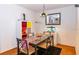 Bright dining area with a glass-top table and colorful decor at 4537 Ring Neck Rd # C, Orlando, FL 32808