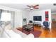 Comfortable living room featuring hardwood floors and a ceiling fan at 4537 Ring Neck Rd # C, Orlando, FL 32808