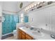 Double vanity, shower/tub combo, and updated fixtures at 1010 Clear Creek Cir, Clermont, FL 34714