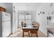 Casual dining area with seating for four and bright natural light at 1010 Clear Creek Cir, Clermont, FL 34714
