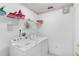 Convenient laundry room with washer, dryer, and shelving at 1010 Clear Creek Cir, Clermont, FL 34714