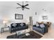 Open living room with two sofas and a glass-top coffee table at 1010 Clear Creek Cir, Clermont, FL 34714