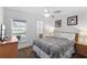 Relaxing main bedroom with a large bed and access to a private bathroom at 1010 Clear Creek Cir, Clermont, FL 34714