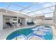 Relaxing pool and patio with seating, creating an outdoor oasis at 1010 Clear Creek Cir, Clermont, FL 34714