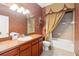 Bathroom with a vanity, sink, and bathtub at 8007 Acadia Estates Ct, Kissimmee, FL 34747