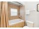 Bathroom with a shower/tub combo and tile at 8007 Acadia Estates Ct, Kissimmee, FL 34747