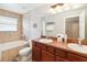 Bathroom with double vanity, bathtub, and tile flooring at 8007 Acadia Estates Ct, Kissimmee, FL 34747