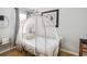 The bedroom features a distinctive carriage bed and wooden floors at 8007 Acadia Estates Ct, Kissimmee, FL 34747