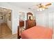 Bedroom with king-size bed, dresser, and bathroom access at 8007 Acadia Estates Ct, Kissimmee, FL 34747