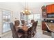 Elegant dining room with a large table and chandelier at 8007 Acadia Estates Ct, Kissimmee, FL 34747