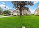 Charming home featuring well-manicured landscaping, a spacious lawn, and inviting curb appeal at 8007 Acadia Estates Ct, Kissimmee, FL 34747