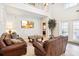 Spacious living room boasting lots of natural light and stylish furnishings at 8007 Acadia Estates Ct, Kissimmee, FL 34747