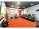 Home theater features reclining seats and a large projection screen for the ultimate movie experience at 8007 Acadia Estates Ct, Kissimmee, FL 34747