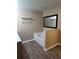 Bathroom with a bathtub and wood-look flooring at 15900 Sw 19Th Avenue Rd, Ocala, FL 34473