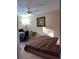 Bedroom with a queen-size bed and a workspace at 15900 Sw 19Th Avenue Rd, Ocala, FL 34473
