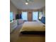 Primary bedroom with king-size bed, large windows and TV at 15900 Sw 19Th Avenue Rd, Ocala, FL 34473