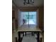 Bright dining area with sliding glass doors leading to a screened patio at 15900 Sw 19Th Avenue Rd, Ocala, FL 34473