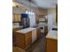 Kitchen boasts an island, stainless steel appliances, and light wood cabinets at 15900 Sw 19Th Avenue Rd, Ocala, FL 34473