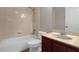 Bathroom features tub, shower, and vanity with granite countertop at 4014 Sunburst View Cir, Kissimmee, FL 34746