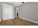 Bedroom with double door closet and wood floor at 4014 Sunburst View Cir, Kissimmee, FL 34746