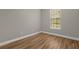 Bright bedroom with wood flooring and window at 4014 Sunburst View Cir, Kissimmee, FL 34746