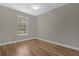 Bedroom with wood flooring and window at 4014 Sunburst View Cir, Kissimmee, FL 34746