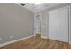 Bedroom with double door closet and wood floor at 4014 Sunburst View Cir, Kissimmee, FL 34746