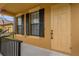 Front entrance with light-yellow door and black shutters at 4014 Sunburst View Cir, Kissimmee, FL 34746