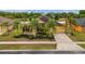 Single-Gathering home with two-car garage, landscaping, and palm trees at 4014 Sunburst View Cir, Kissimmee, FL 34746