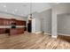 Kitchen with dark wood cabinets, granite counters, and island at 4014 Sunburst View Cir, Kissimmee, FL 34746