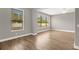 Living area with large windows and wood-look tile floors at 4014 Sunburst View Cir, Kissimmee, FL 34746