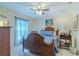 Cozy bedroom with a wooden bed frame, soft lighting, and calming blue accents at 12854 Sw 77Th Cir, Ocala, FL 34473