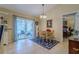 Bright dining area with sliding glass doors leading to the outdoors and comfortable seating at 12854 Sw 77Th Cir, Ocala, FL 34473