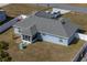 Aerial view of backyard with screened patio, fountain, and white vinyl fence at 12854 Sw 77Th Cir, Ocala, FL 34473