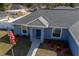 Aerial view of the front of a well-maintained single-Gathering home with American flag at 12854 Sw 77Th Cir, Ocala, FL 34473