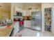 Functional kitchen with stainless appliances, ample storage, and granite countertops at 12854 Sw 77Th Cir, Ocala, FL 34473