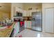 Bright kitchen featuring granite countertops, stainless steel appliances, and ample cabinet space at 12854 Sw 77Th Cir, Ocala, FL 34473