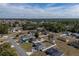 Aerial view of a neighborhood, highlighting the subject home with its fenced-in backyard at 12854 Sw 77Th Cir, Ocala, FL 34473