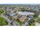 Aerial view of community featuring multiple buildings,lake, and ample parking at 3751 Conroy Rd # 2320, Orlando, FL 32839