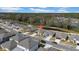 Aerial view of a house in a residential neighborhood near a pond at 1856 Red Loop, Lakeland, FL 33801